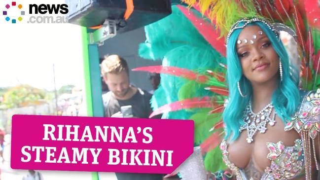 Rihanna sizzles in barely there green bikini as she shows of her