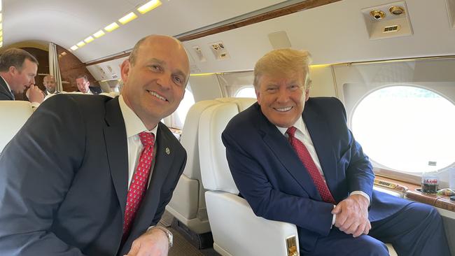 Heritage Foundation president Kevin Roberts with Donald Trump on a private plane in April 2022.