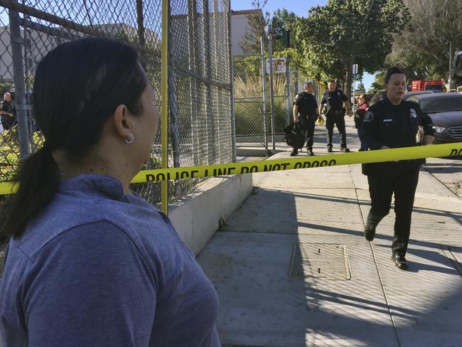 Gloria Echeverria waits for word on her son after a shooting occurred at a Los Angeles school. A female suspect is in custody. Picture: AP/Amanda Lee Myers