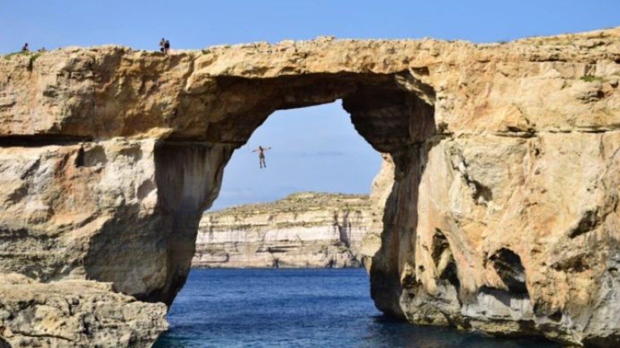 Cliff diving in Gozo, Malta.