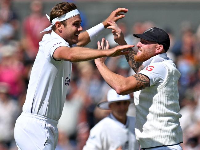 Stuart Broad (L) and England captain Ben Stokes celebrate a rare Test milestone for the champion paceman. Picture: Oli Scarff/AFP
