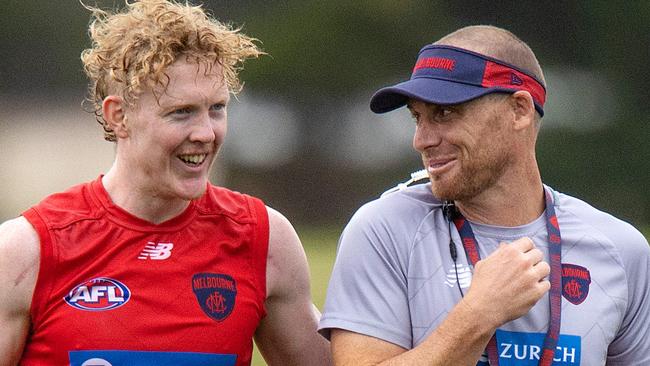 MELBOURNE, FEBRUARY 9, 2022: Melbourne Football Club coach Simon Goodwin pictured with Clayton Oliver during MFC training at Casey Fields. Picture: Mark Stewart