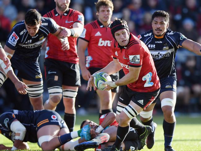 Matt Todd of the Crusaders looks to pass the ball against the Brumbies last year.