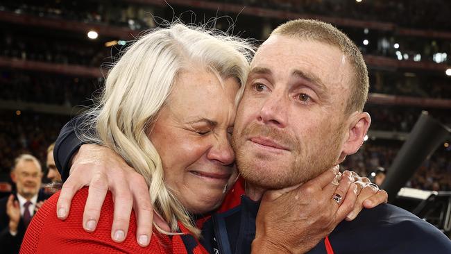 An emotional Simon Goodwin hugs president Kate Roffey after the game. Picture: Michael Klein