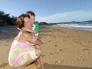 Bronwyn Zelinski ran to pull her son Myles away from the water as a shark attacked a surfer at Archie’s Beach on Wednesday. . Picture: Rob Barich