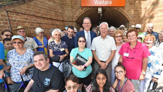 Ku-ring-gai MP Alister Henskens and Bill Aitken with commuters at Waitara train station. Picture: Troy Snook