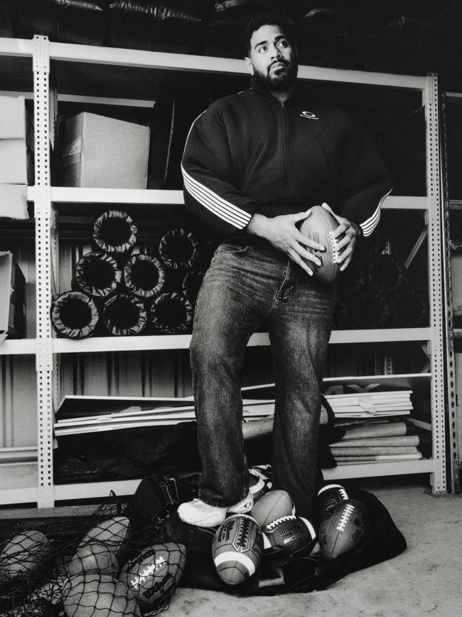 Mailata wears loop Sports Icon jacket, jeans, trainer, by Balenciaga.