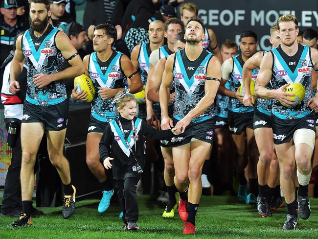 ADELAIDE, AUSTRALIA - JUNE 08:  Travis Boak of the Power leads his team onto the ground during the round 12 AFL match between the Port Adelaide Power and the Richmond Tigers at Adelaide Oval on June 8, 2018 in Adelaide, Australia.  (Photo by Daniel Kalisz/Getty Images)