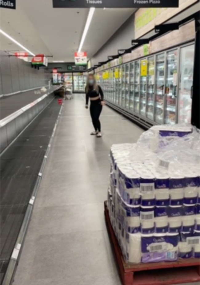 Footage of a shopper performing a toilet paper stunt in a Woolworths supermarket has angered TikTok users. Picture: TikTok