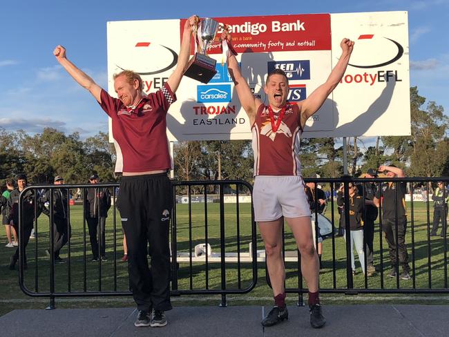 Whitehorse Pioneers coach Jamie Carpenter and captain Maverick Gleed celebrate the premiership.