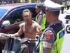 Heated moment Bali cops clash with tourist
