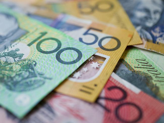 Australian money background showing $100, $50 and $20 notes with a shallow depth of field.