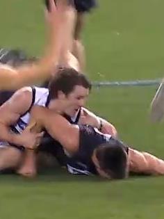 The Carlton ruckman has his head slammed into the turf.