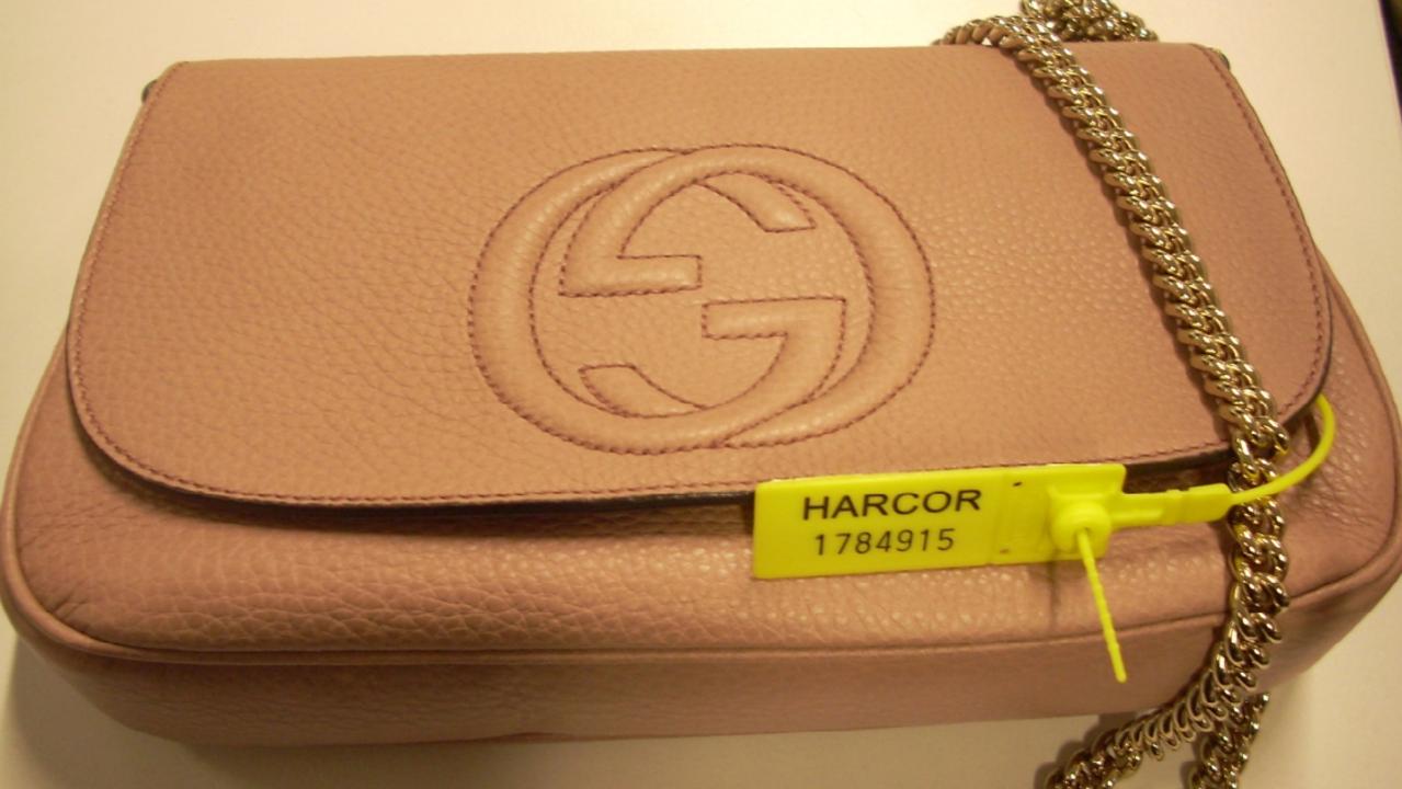 A tan Gucci designer handbag.