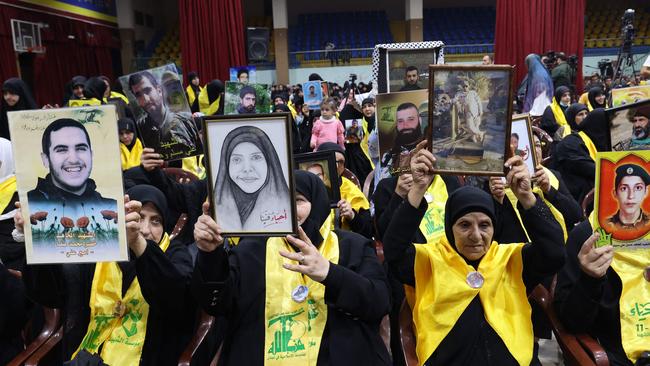 The mothers of killed Hezbollah fighters and other supporters of the terrorist group, watch the televised address of Hezbollah chief Hassan Nasrallah. Picture: AFP