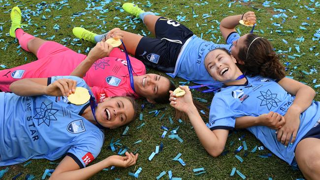 Sydney FC players enjoy the moment after winning the last W-League grand final.