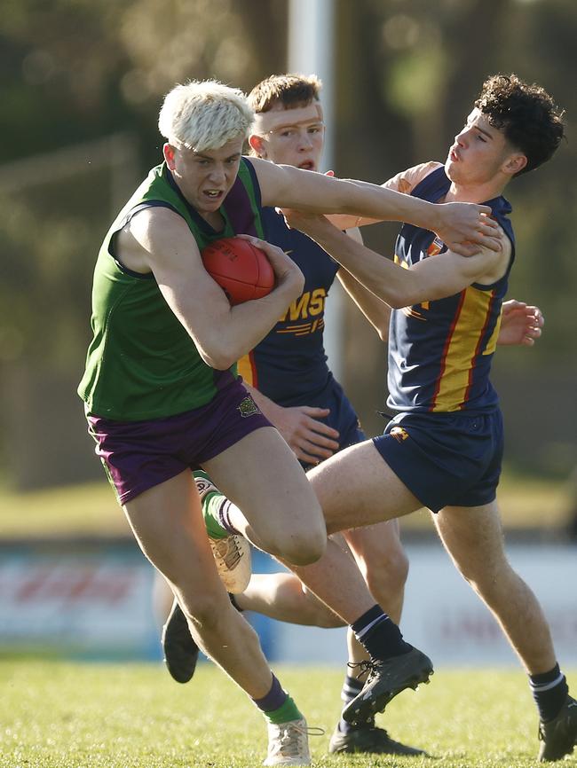 Caddy shrugs a tackle. (Photo by Daniel Pockett/AFL Photos/via Getty Images)