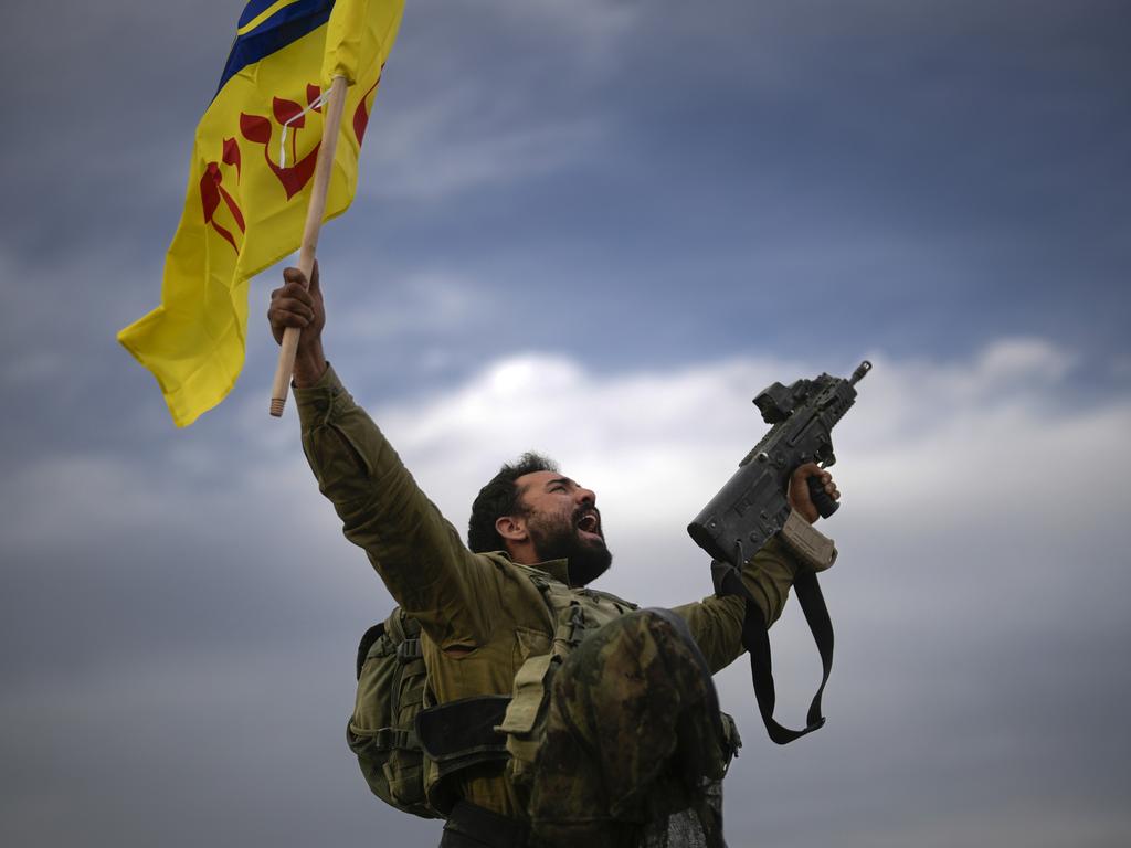 An Israeli soldier takes a moment to celebrate his return from the Gaza Strip. Picture: Christopher Furlong/Getty Images