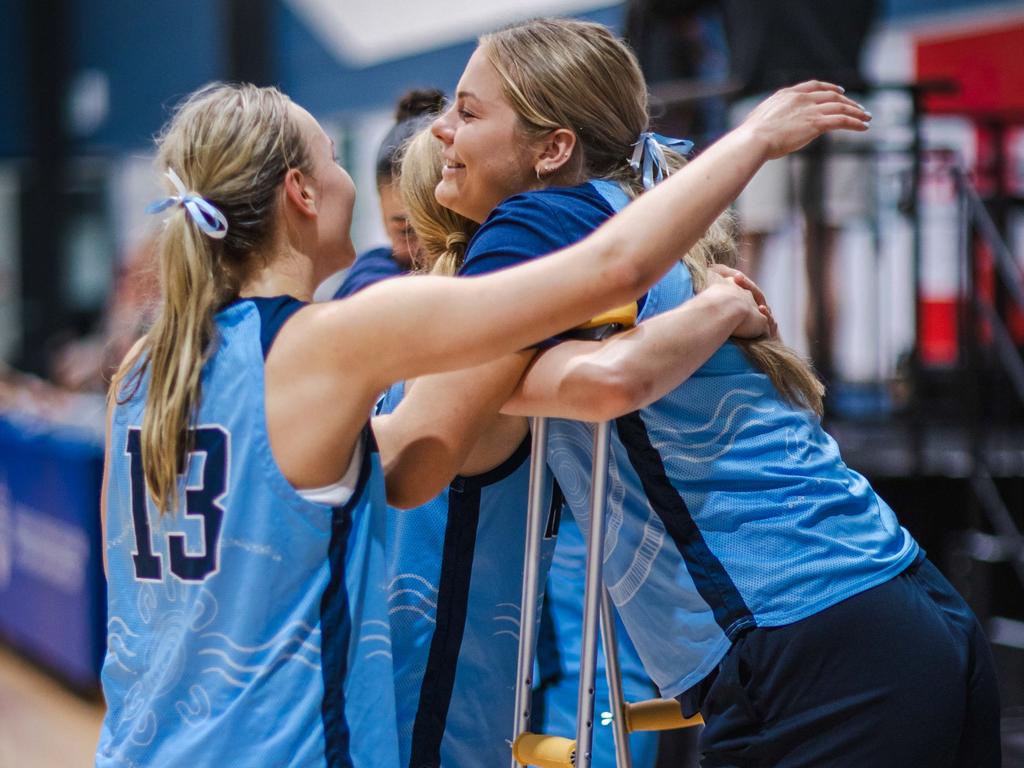 Isla Juffermans on crutches celebrates after NSW won the bronze medal at the Under-20 National Championships. Picture: Taylor Earnshaw