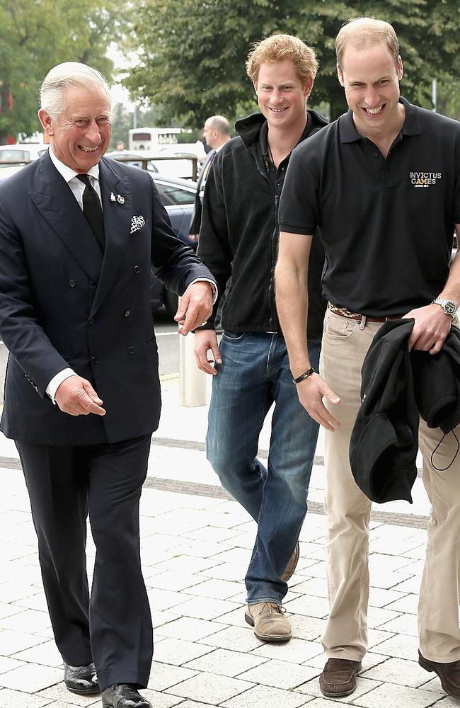 Harry – seen here with his father and brother in 2014 – has multiple legal battles. Picture: Chris Jackson/Getty Images