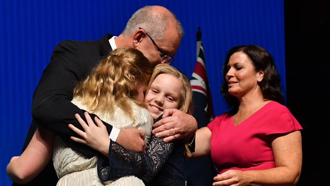 Prime Minister Scott Morrison hugs his daughters as he launched the party’s campaign earlier this month. Picture: AAP Image/Mick Tsikas