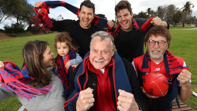 AFL great Ron Barassi with Melbourne fans [clockwise from Ron] Romy Lipson, Asher Lipson (age 2), Michael Lipson, Daniel Roth and Joseph Roth. Picture: Alex Coppel