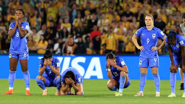 Devastated France players absorb a crushing defeat. Picture: Adam Head