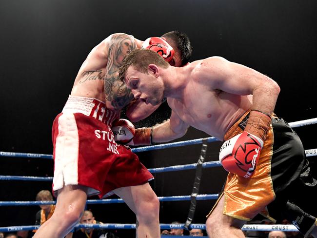 Jeff Horn digs in a body punch against Michael Zerafa at the Brisbane Convention and Exhibition Centre on December 18. (Photo by Bradley Kanaris/Getty Images)