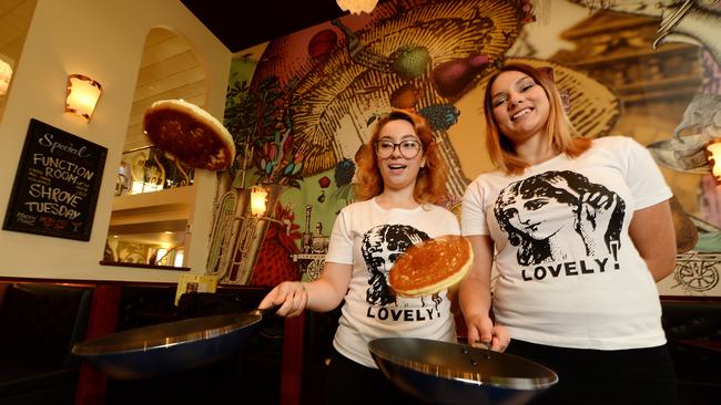 Beth Paterson and India Moore flipping pancakes inside Pancake Parlour’s Doncaster restaurant.