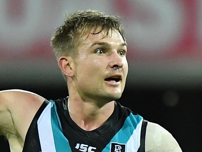 GOLD COAST, AUSTRALIA - SEPTEMBER 05: Ollie Wines of Port Adelaide celebrates kicking a goal during the round 16 AFL match between the North Melbourne Kangaroos and the Port Adelaide Power at Metricon Stadium on September 05, 2020 in Gold Coast, Australia. (Photo by Matt Roberts/AFL Photos/via Getty Images)