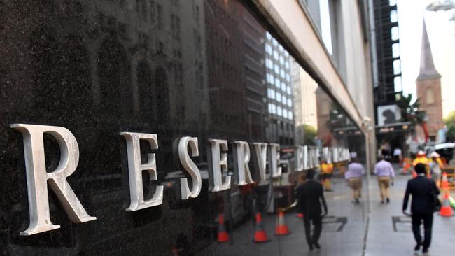 A pedestrian walks past the Reserve Bank of Australia in Sydney. Picture: AAP