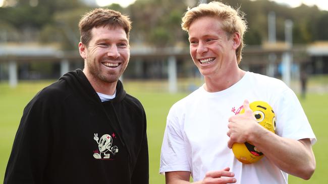 Giants Toby Greene with Sydney's Isaac Heeney during the 5th Quarter Camps kids clinic at Tramway Oval on July 17, 2024.. Photo by Brett Costello(Image Supplied for Editorial Use only - **NO ON SALES** - Â©Brett Costello )