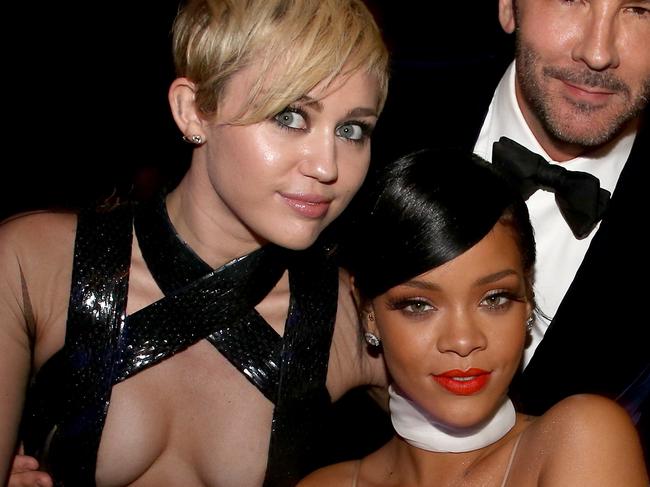 HOLLYWOOD, CA - OCTOBER 29: (L-R) Recording artists Miley Cyrus, Rihanna and honoree Tom Ford attend amfAR LA Inspiration Gala honoring Tom Ford at Milk Studios on October 29, 2014 in Hollywood, California. (Photo by Christopher Polk/Getty Images for amfAR)