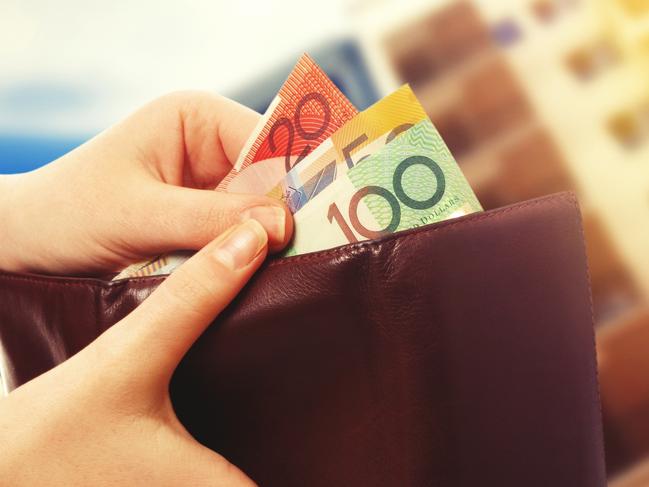 AUSTRALIAN CURRENCY/ DOLLARS/  PICTURE: istock australian money in wallet on real estate background