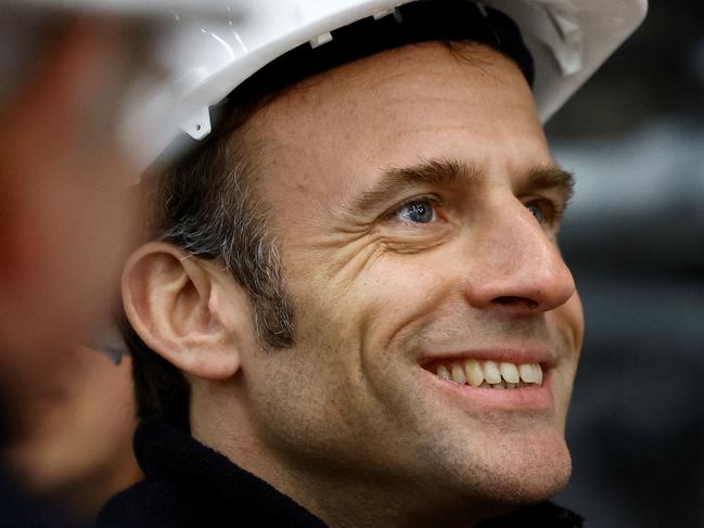 French President Emmanuel Macron, wearing a working helmet, visits the restoration site at the Notre-Dame de Paris Cathedral, which was damaged in a devastating fire four years ago, in Paris, France, April 14, 2023. (Photo by SARAH MEYSSONNIER / POOL / AFP)