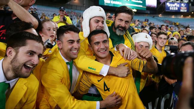 Tim Cahill celebrates with fans after his final match. Picture: Brett Costello