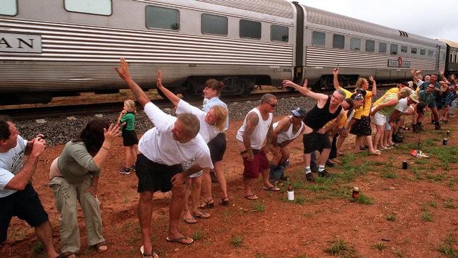 The Ghan passes Livingstone airstrip. The Great Moon. People mooning the train.