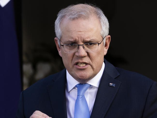 SYDNEY, AUSTRALIA - JULY 13: Australian Prime Minister Scott Morrison speaks during a press conference at Kirribilli House on July 13, 2021 in Sydney, Australia. Prime Minister Scott Morrison and NSW Premier Gladys Berejiklian have announced a financial assistance package to support NSW households and businesses affected by the current COVID-19 lockdown. The combined federal and state support package will see the COVID-19 disaster payment increased to $600 from week four of lockdown, if a person has lost 20 or more hours of work a week, or $375 if a person has lost between eight and 20 hours of work a week. A new business support payment will also be available to entities with an annual turnover between $75,000 and $50 million who can demonstrate a 30 percent decline in turnover. COVID-19 lockdown restrictions are currently in place across Greater Sydney, the Blue Mountains, the Central Coast and Wollongong as NSW continues to record new community COVID-19 cases. All residents are subject to stay-at-home orders and are only permitted to leave their homes for essential reasons, including purchasing essential goods, accessing or providing care or healthcare, work, education and exercise. (Photo by Jenny Evans/Getty Images)