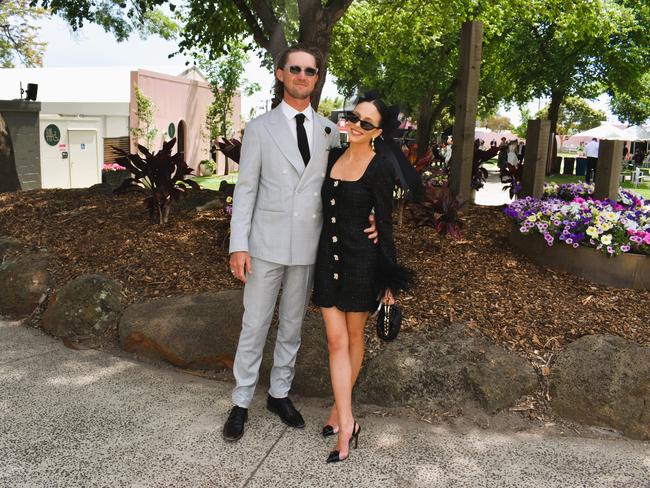 Guests in striking racewear at Penfolds Derby Day at the Flemington Racecourse on Saturday, November 02, 2024: Blake Matthews and Lily Reguson. Picture: Jack Colantuono