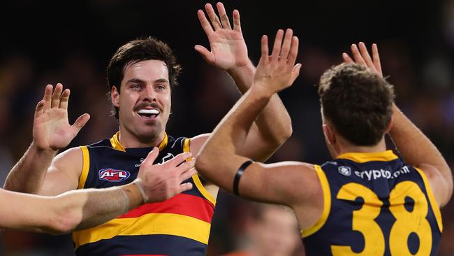 ADELAIDE, AUSTRALIA - JUNE 29: Darcy Fogarty of the Crows celebrates a goal with Lachlan Sholl during the 2024 AFL Round 16 match between the Adelaide Crows and the GWS GIANTS at Adelaide Oval on June 29, 2024 in Adelaide, Australia. (Photo by Sarah Reed/AFL Photos via Getty Images)