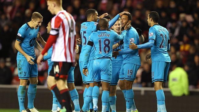 Tottenham celebrate an own goal by Sunderland defender John O'Shea.