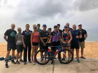 TRIATHLETES UNITED: Tony Young, Gayle Young, Carol McNaughton, Trudy Pavey, Tony Webster, Ken Wood, Catherine Wood, Katrina Tate, Richard James, Kaliki James, Jeff Morris, Troy Geltch and Reed Mackay who competed in Cairns last Sunday. Picture: Contributed