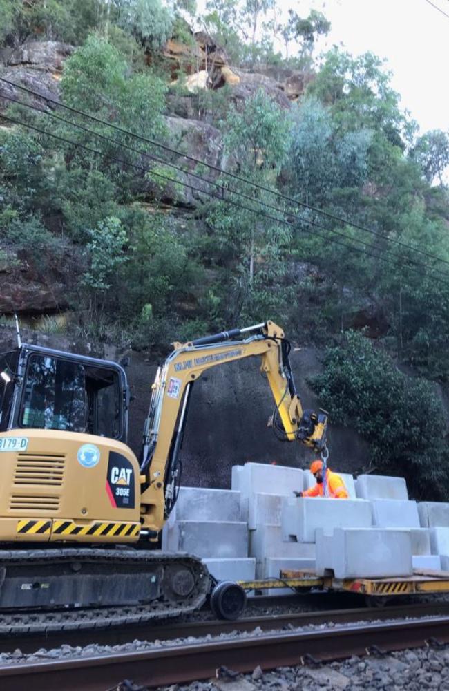 Cranes will be used to lower the sandstone boulder piece by piece.