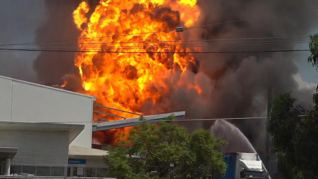 Explosions heard: 100 firefighters battle Western Sydney factory blaze