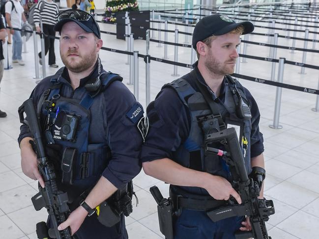 ADELAIDE, AUSTRALIA - NewsWire Photos DECEMBER 18 2023:  AFP AIRPORT PATROL. Protective Service Officer Grade 1 Patrick Barry and Protective service officer Brendan Bates.Picture: NCA NewsWire / Roy VanDerVegt