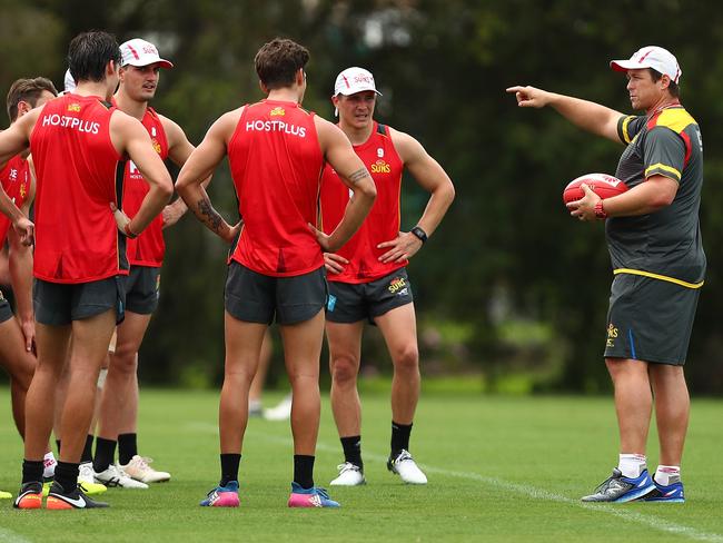 GOLD COAST, AUSTRALIA - NOVEMBER 06:  Senior coach Stuart Dew talks to players during a Gold Coast Suns AFL training session at Metricon Stadium on November 6, 2017 in Gold Coast, Australia.  (Photo by Chris Hyde/Getty Images)