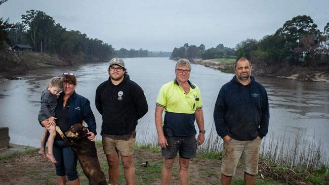 Pictured on the banks of The Hawkesbury River in Wilberforce are (L-R): Raelene Hodgskin holding her grand-daughter Alice Sultana (3) and dog Rusty. Cameron Hodgskin (her son) (25). Husband Anthony Hodgskin (55) Paul Saad (43). All from Wilberforce.