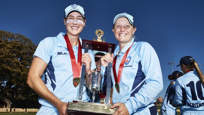 SYDNEY, AUSTRALIA — FEBRUARY 09: Alyssa Healy of the Breakers and Ellyse Perry and Alyssa Healy, of the New South Wales Breakers, pose with the trophy after winning the Women's National Cricket League Final over Queensland Fire last weekend. Picture: Brett Hemmings/Getty Images