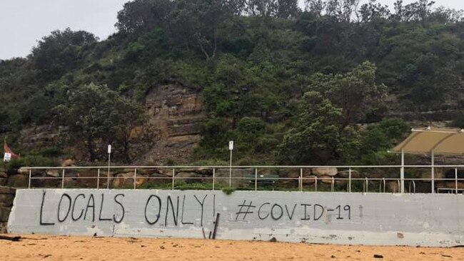 Graffiti painted on a wall close to the famous North Narrabeen surf break in late March, allegedly by local surfers trying to keep people who don't live in the postcode of 2101 off "their beach". Picture: Facebook