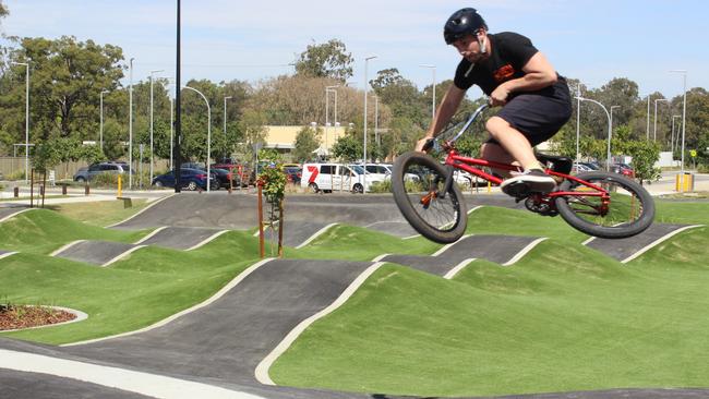 Chris Bierton takes his bike for a spin on the Bracken Ridge BMX track which he designed. Picture: Michelle Smith